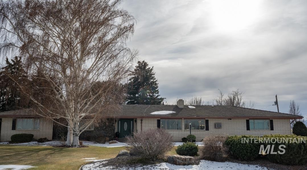 549 West 800 S Road Burley, ID 83318 - Photo 1 of 21 Single story home with a chimney and brick siding