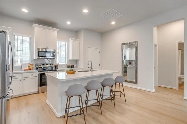 a kitchen with counter space cabinets and appliances
