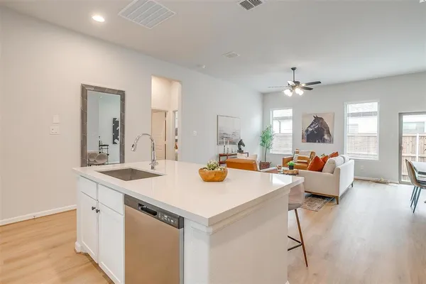 a view of living room with furniture and wooden floor
