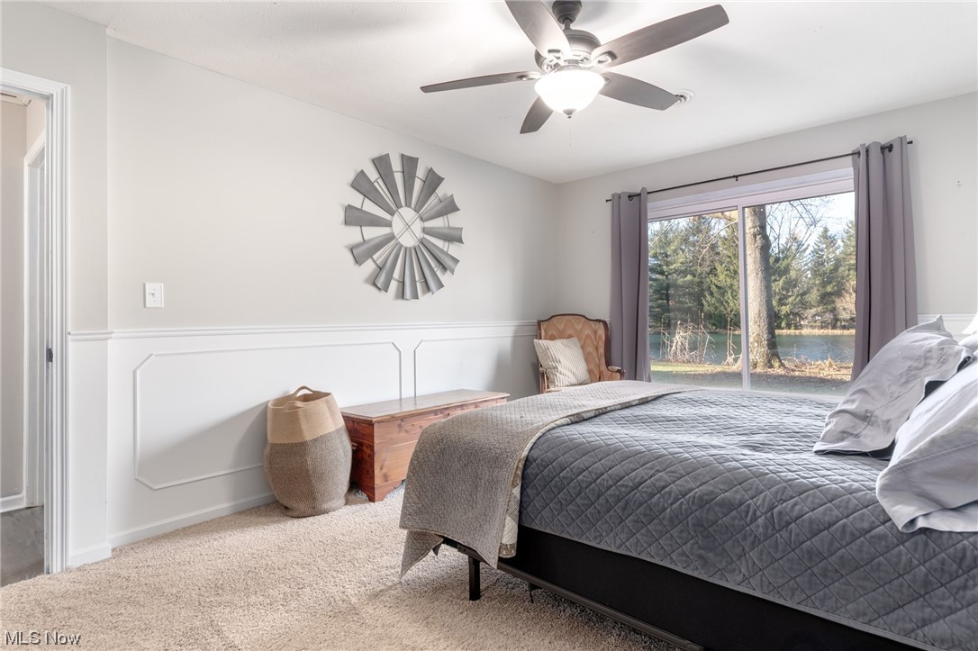 4529 Beat Road Litchfield, OH 44253 - Photo 21 of 42 Bedroom with ceiling fan and light colored carpet