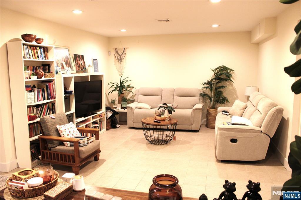 294-296 Tenafly Road Tenafly, NJ 07670 - Photo 10 of 24 a living room with furniture and a flat screen tv