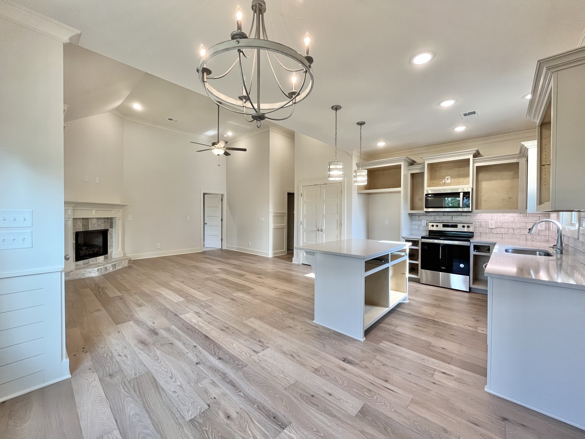 811 Ridgestone Place, Unit 98 Lebanon, TN 37087 - Photo 11 of 21 a large kitchen with a center island wooden floor stainless steel appliances and cabinets