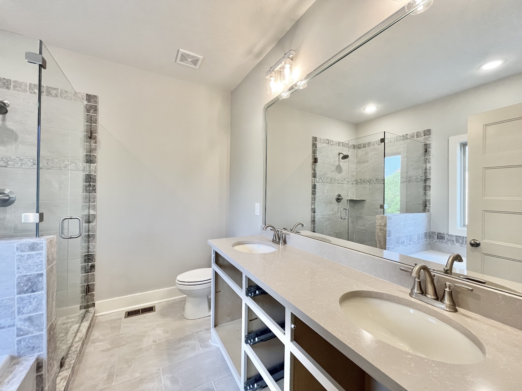 811 Ridgestone Place, Unit 98 Lebanon, TN 37087 - Photo 14 of 21 a bathroom with a granite countertop sink a toilet and shower
