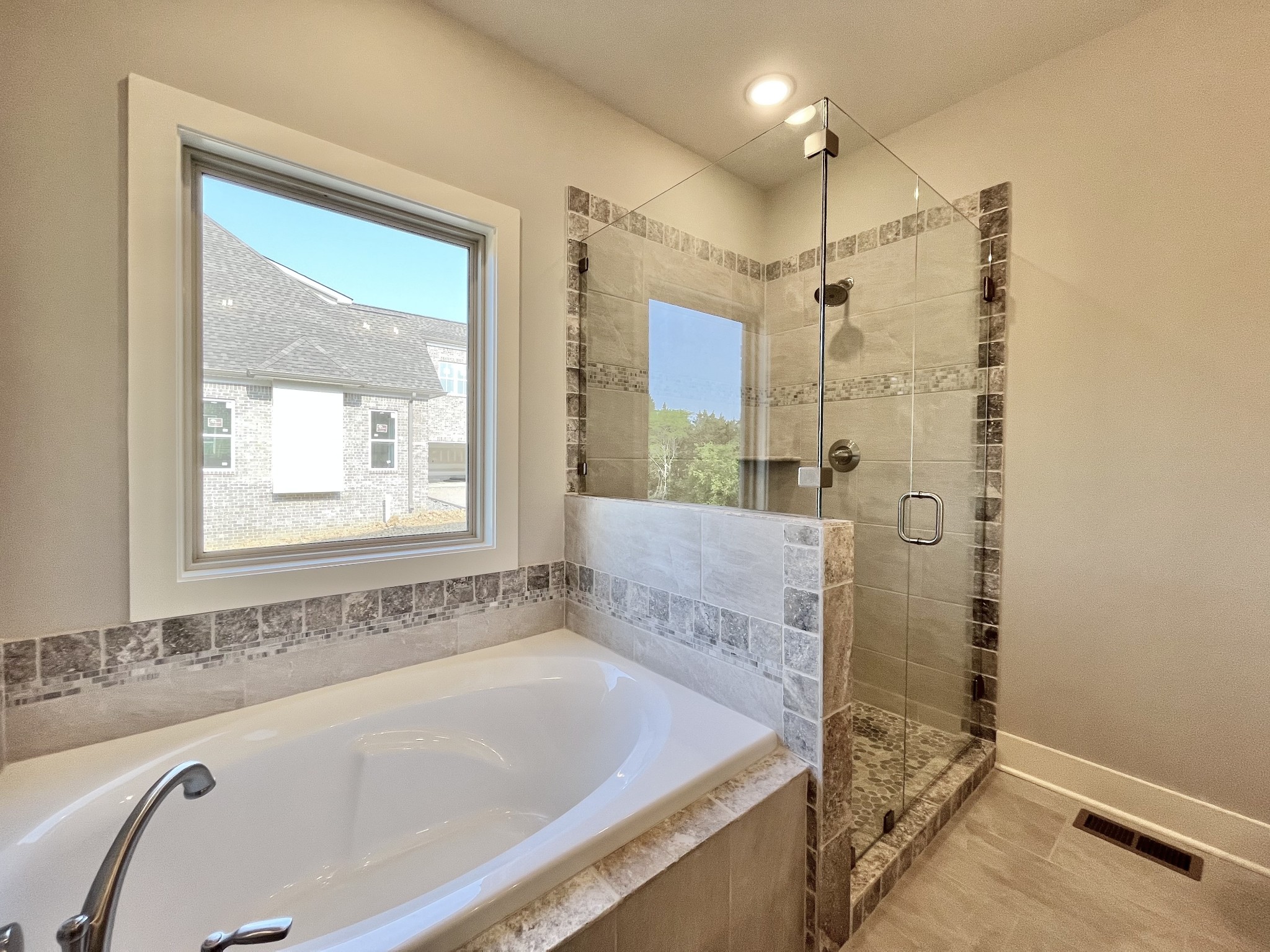 811 Ridgestone Place, Unit 98 Lebanon, TN 37087 - Photo 16 of 21 a bathroom with a tub sink and mirror