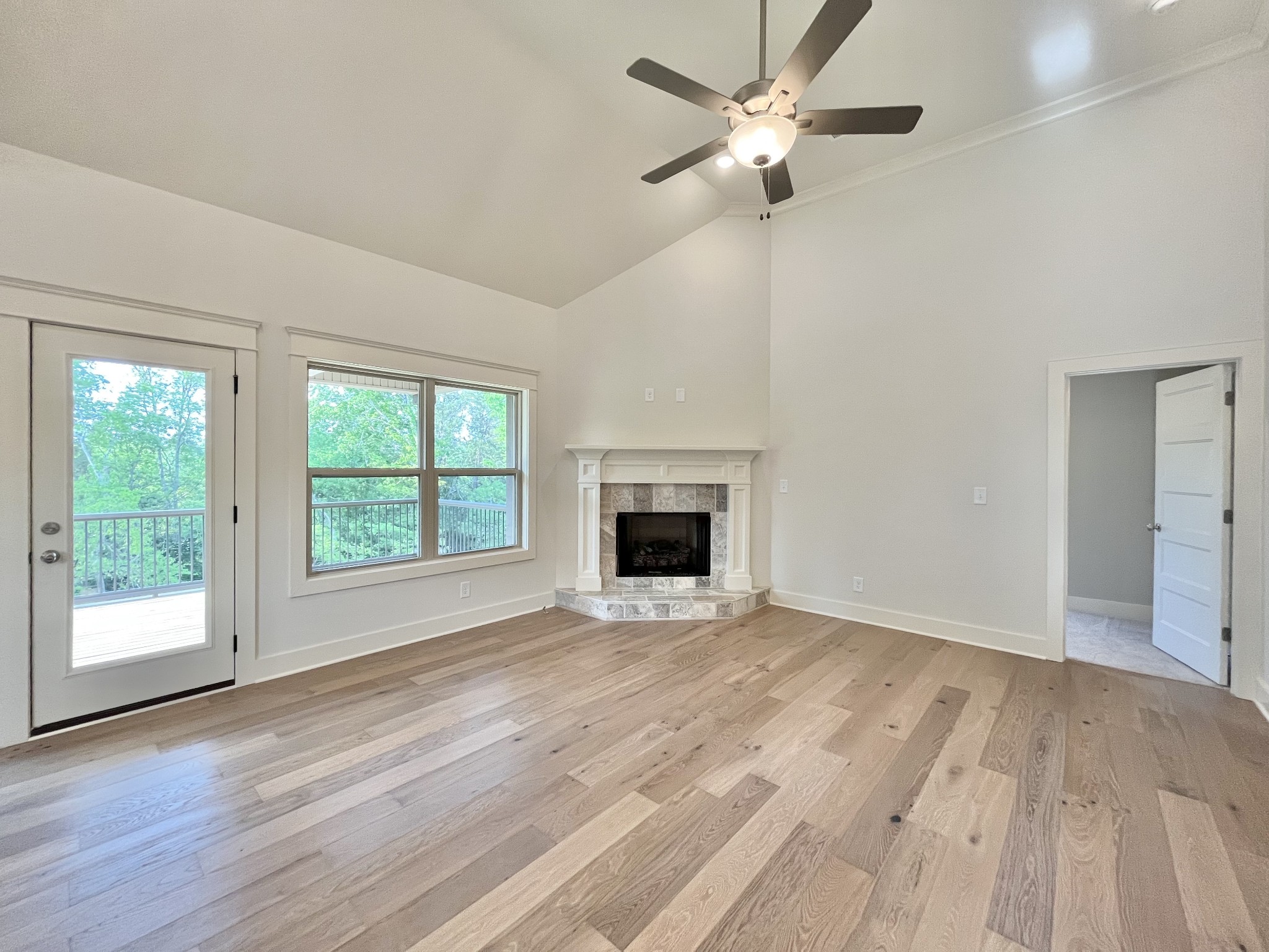 811 Ridgestone Place, Unit 98 Lebanon, TN 37087 - Photo 3 of 21 a view of an empty room with a window and wooden floor