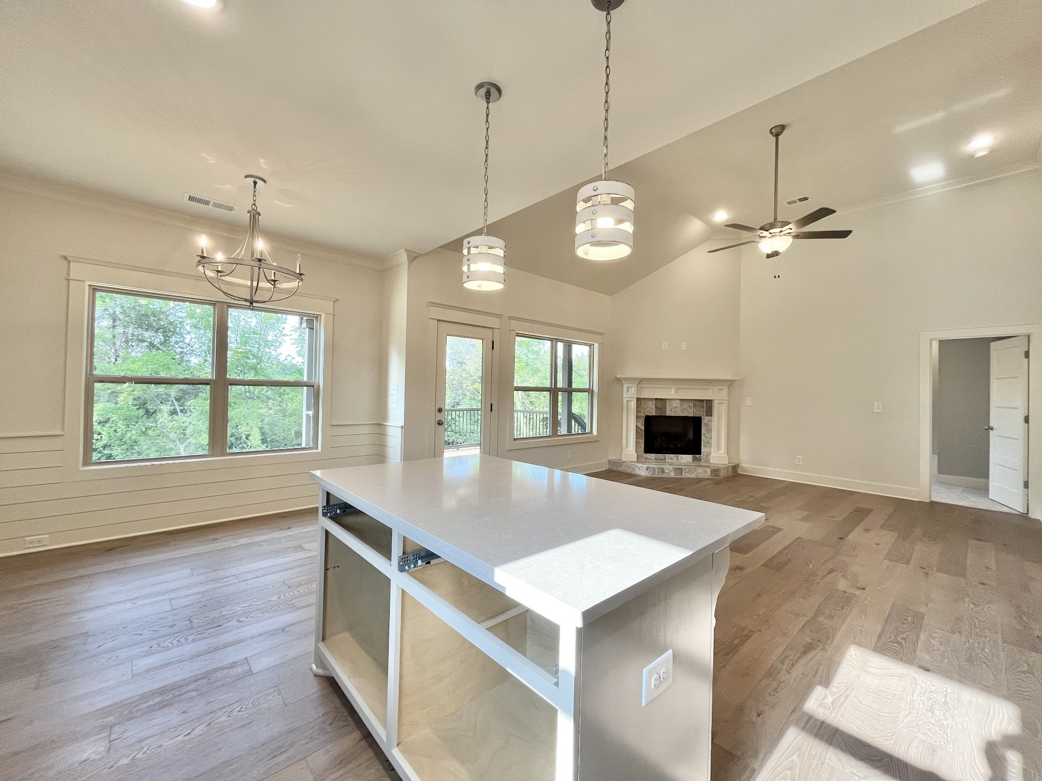 811 Ridgestone Place, Unit 98 Lebanon, TN 37087 - Photo 7 of 21 a view of an empty room with window wooden floor and a kitchen view