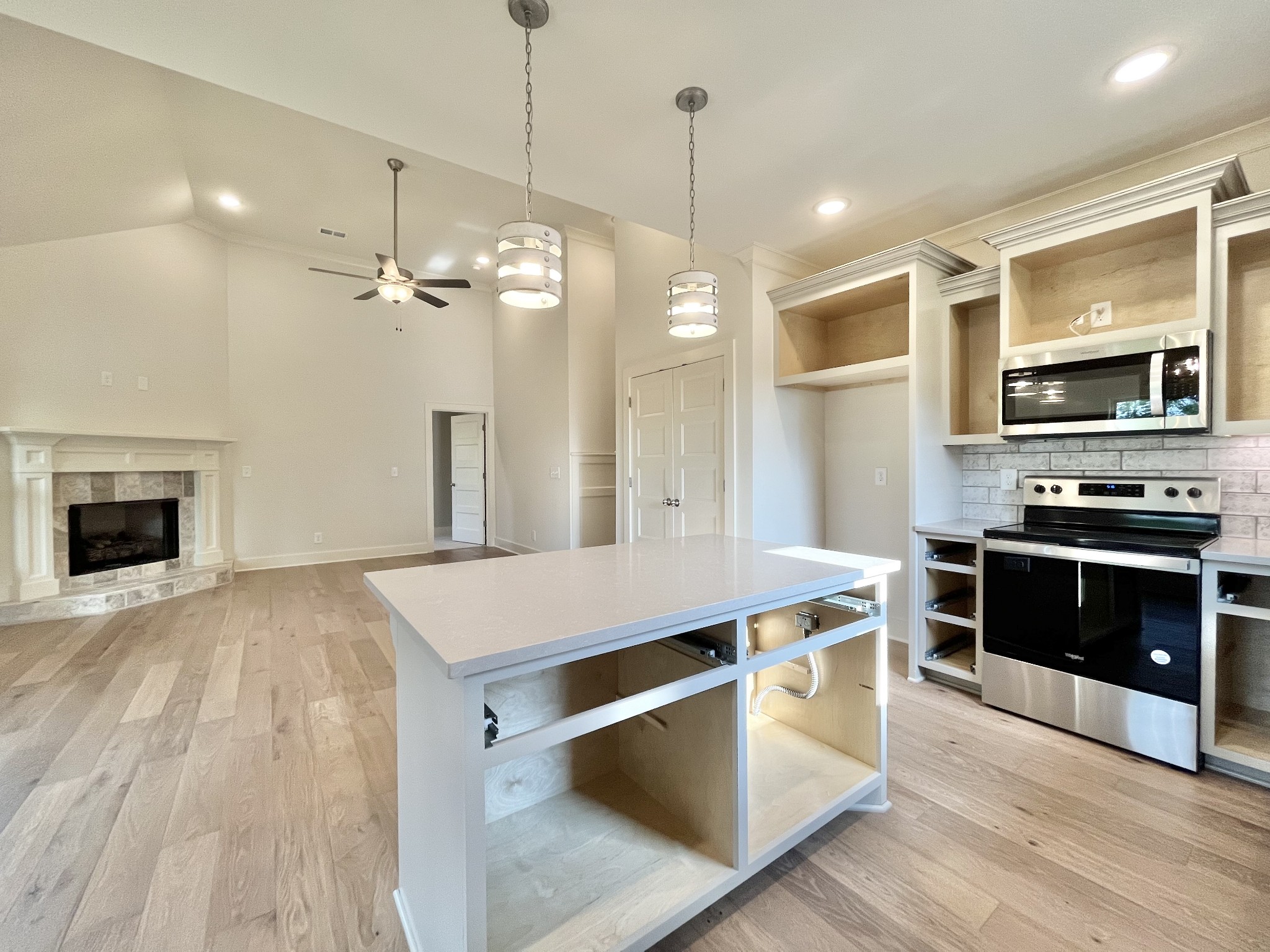811 Ridgestone Place, Unit 98 Lebanon, TN 37087 - Photo 8 of 21 a kitchen with a stove and a wooden floor