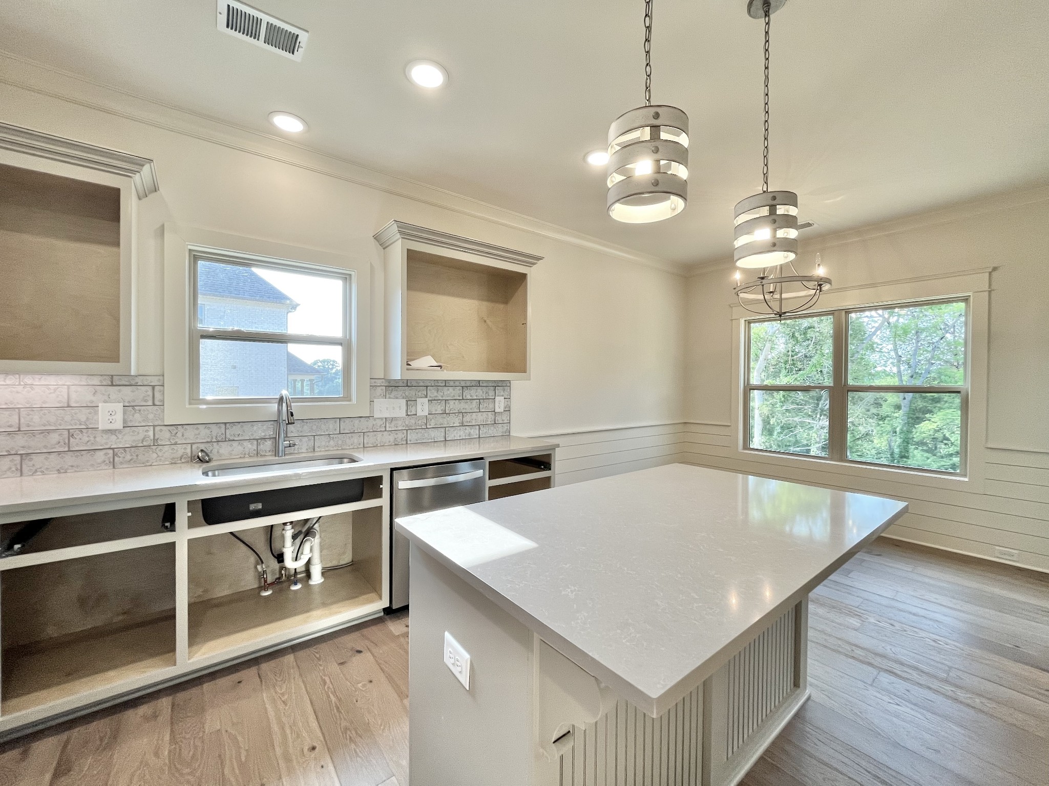 811 Ridgestone Place, Unit 98 Lebanon, TN 37087 - Photo 9 of 21 a kitchen with stainless steel appliances granite countertop a sink a stove and a wooden floors