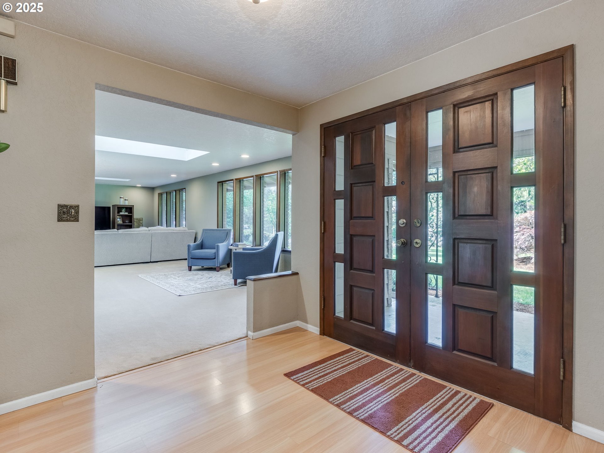11963 Broadacres Road Northeast Hubbard, OR 97032 - Photo 15 of 42 a living room with furniture and a rug