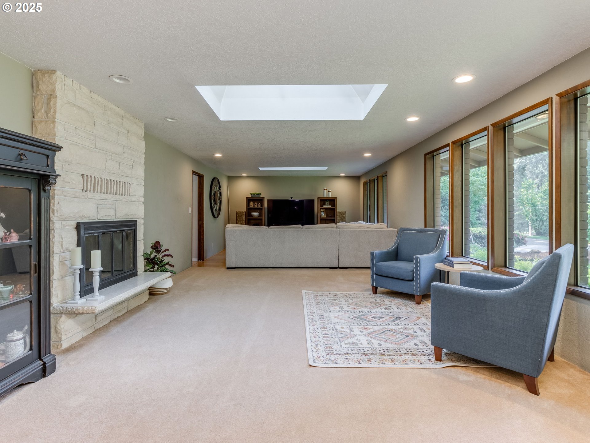 11963 Broadacres Road Northeast Hubbard, OR 97032 - Photo 16 of 42 a living room with furniture and a fireplace