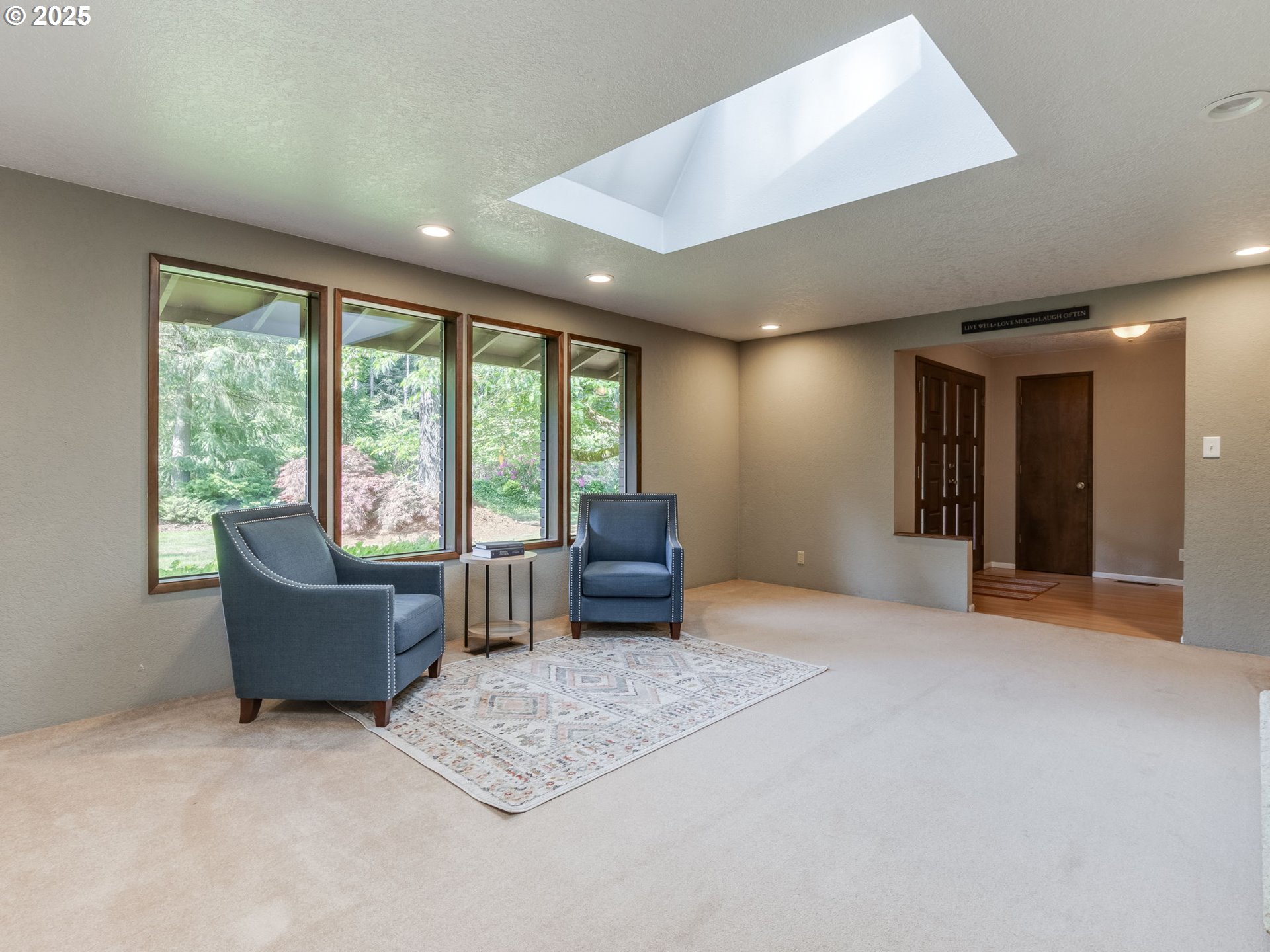 11963 Broadacres Road Northeast Hubbard, OR 97032 - Photo 18 of 42 a living room with furniture and a large window