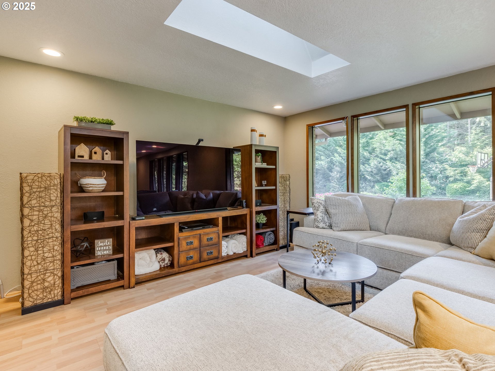 11963 Broadacres Road Northeast Hubbard, OR 97032 - Photo 19 of 42 a living room with furniture and a flat screen tv