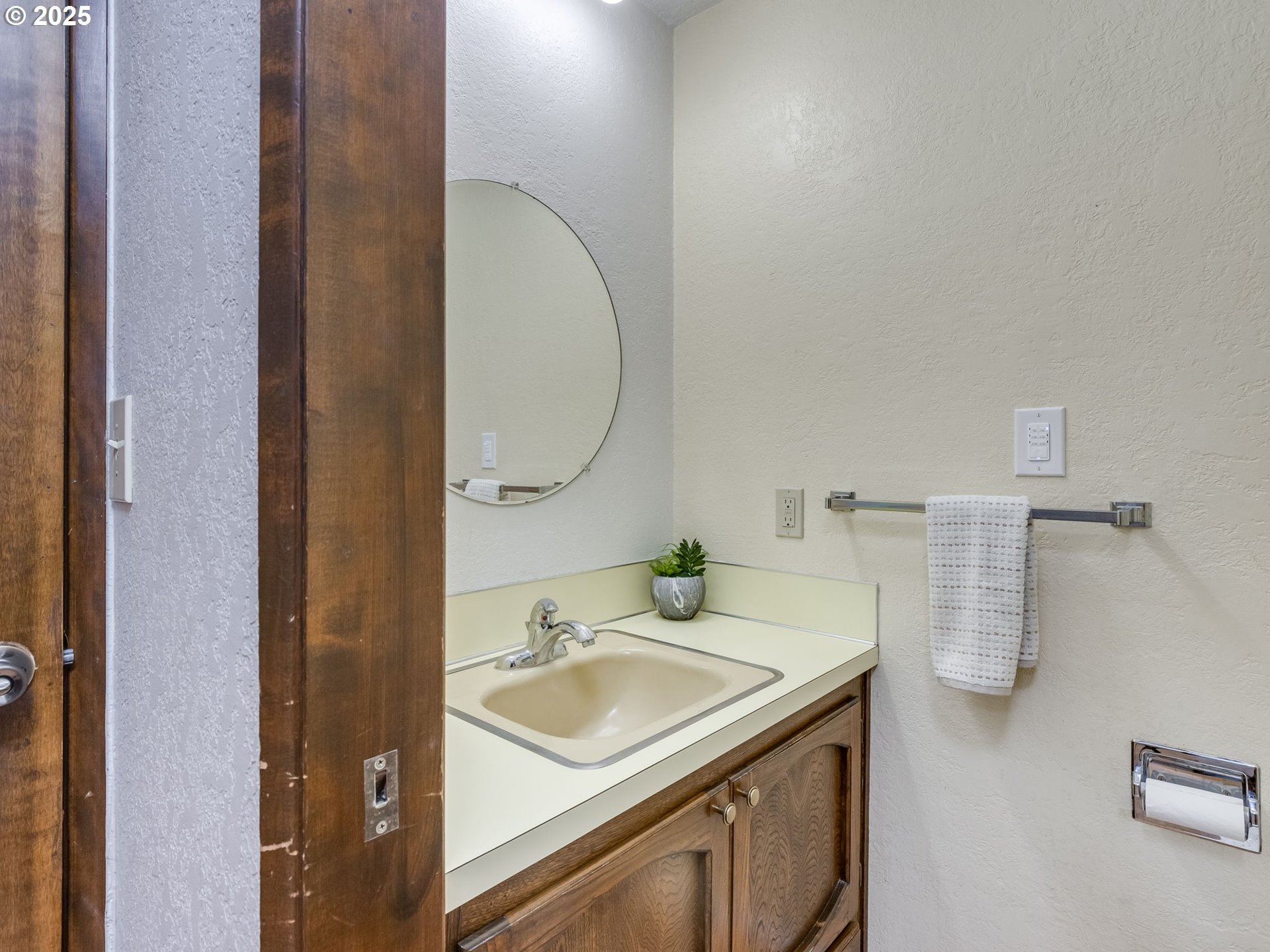 11963 Broadacres Road Northeast Hubbard, OR 97032 - Photo 23 of 42 a bathroom with a sink and a mirror