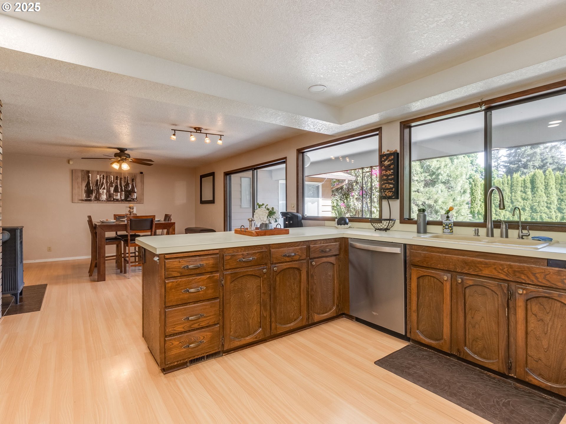 11963 Broadacres Road Northeast Hubbard, OR 97032 - Photo 24 of 42 a large kitchen with stainless steel appliances granite countertop a large window and a counter space