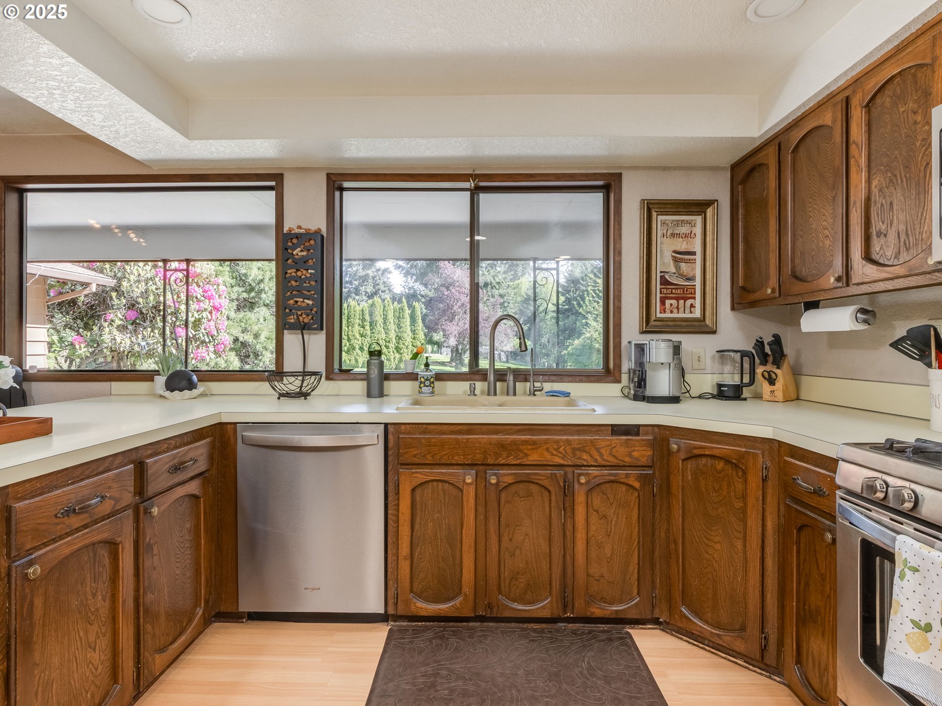 11963 Broadacres Road Northeast Hubbard, OR 97032 - Photo 25 of 42 a kitchen with a sink stove and cabinets