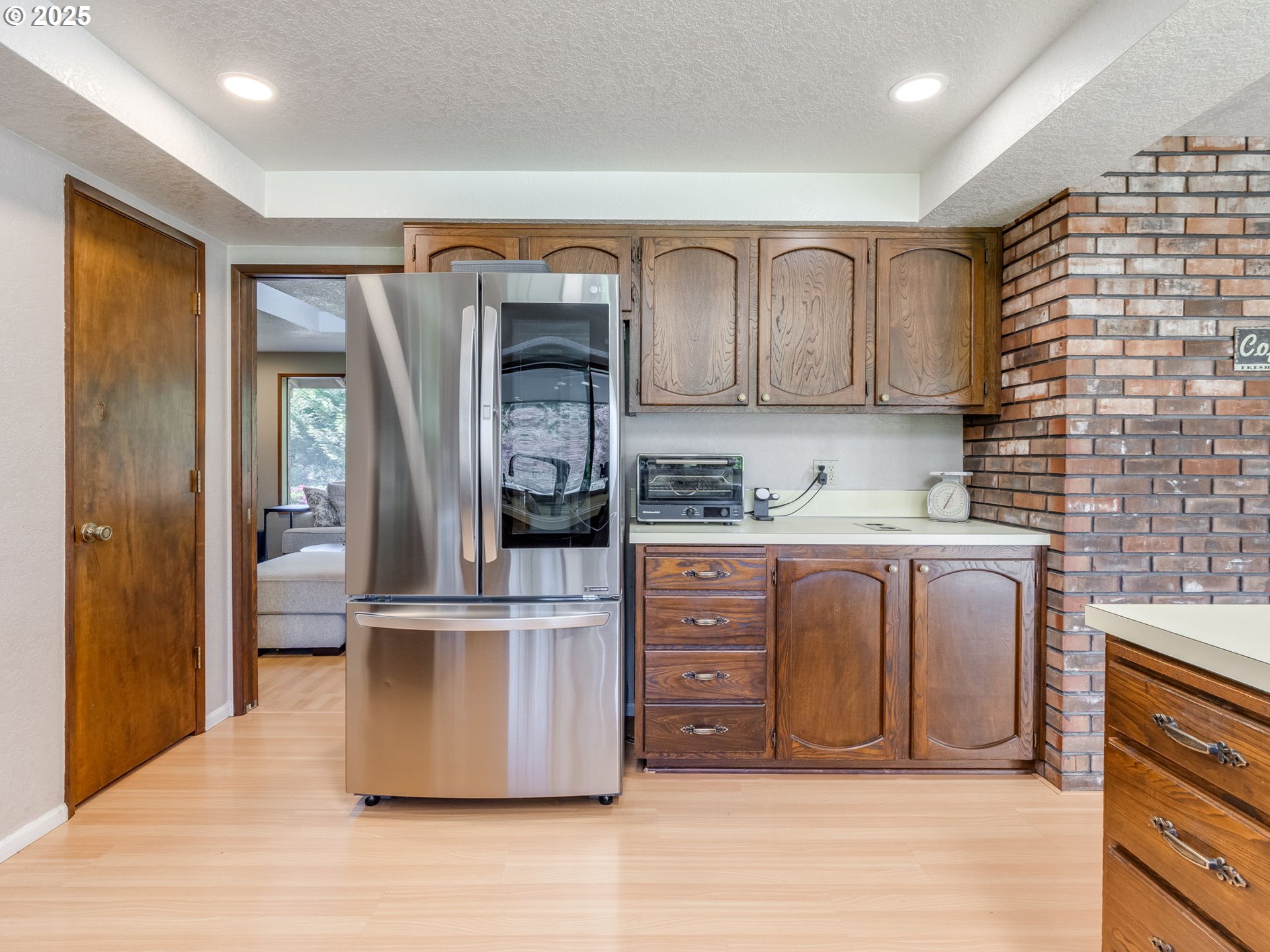11963 Broadacres Road Northeast Hubbard, OR 97032 - Photo 27 of 42 a kitchen with stainless steel appliances granite countertop a refrigerator and a stove