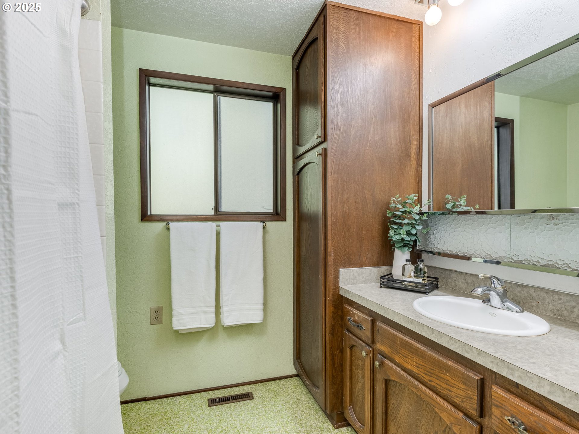 11963 Broadacres Road Northeast Hubbard, OR 97032 - Photo 34 of 42 a bathroom with a granite countertop sink and a mirror