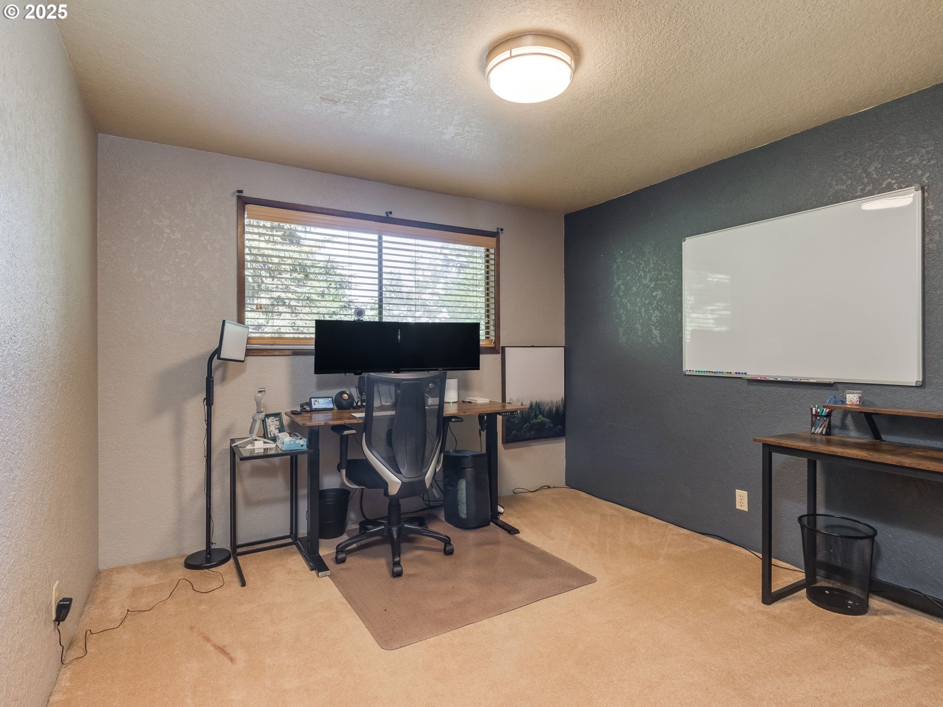 11963 Broadacres Road Northeast Hubbard, OR 97032 - Photo 35 of 42 a view of a workspace with furniture and a window