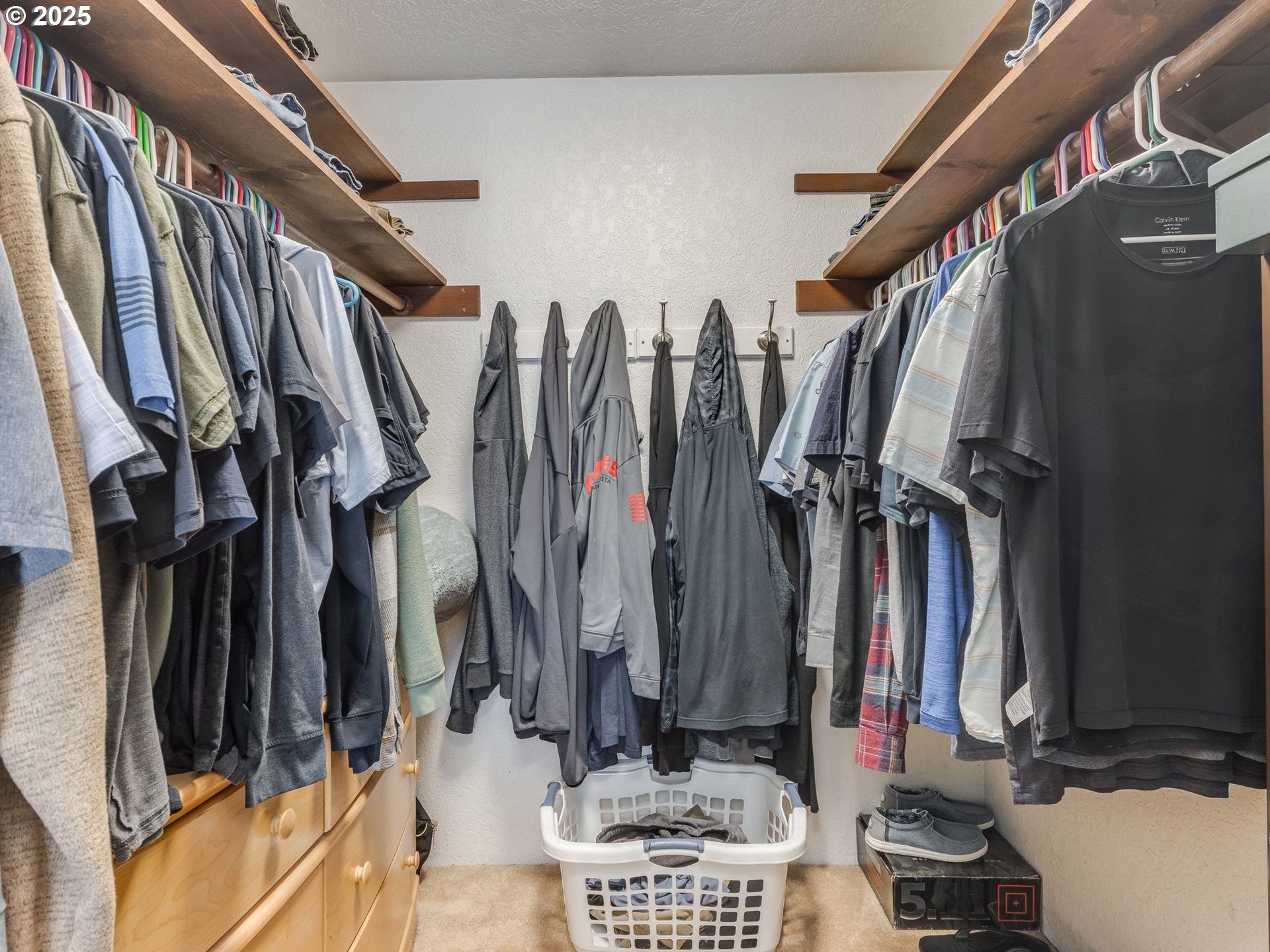 11963 Broadacres Road Northeast Hubbard, OR 97032 - Photo 40 of 42 a view of walk in closet with clothes and shoes
