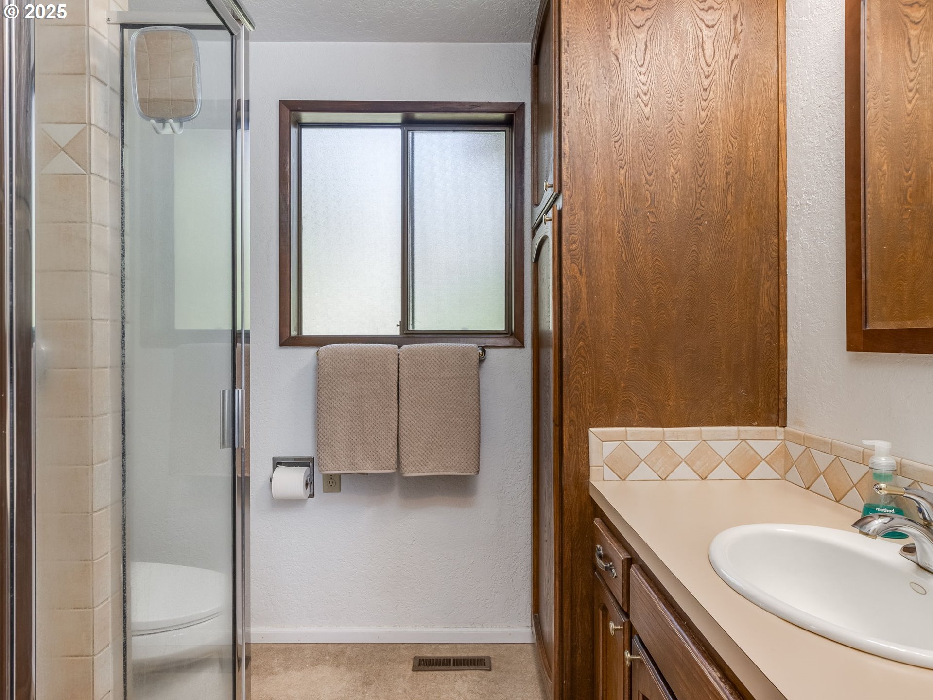 11963 Broadacres Road Northeast Hubbard, OR 97032 - Photo 41 of 42 a bathroom with a sink a mirror and a shower