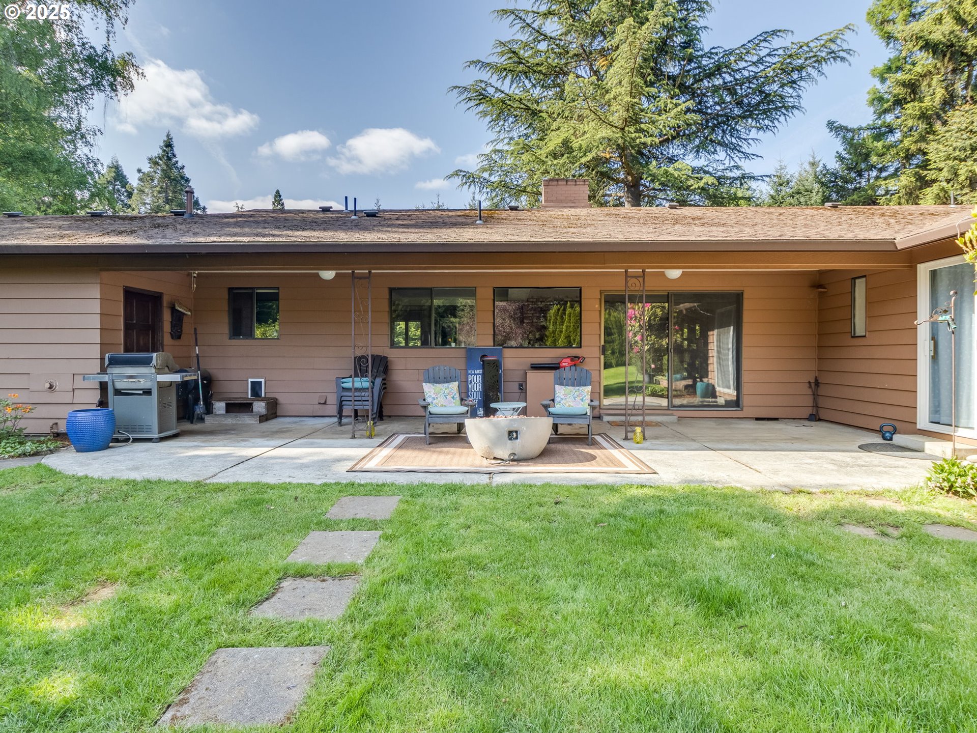 11963 Broadacres Road Northeast Hubbard, OR 97032 - Photo 6 of 42 a view of a house with backyard porch and sitting area