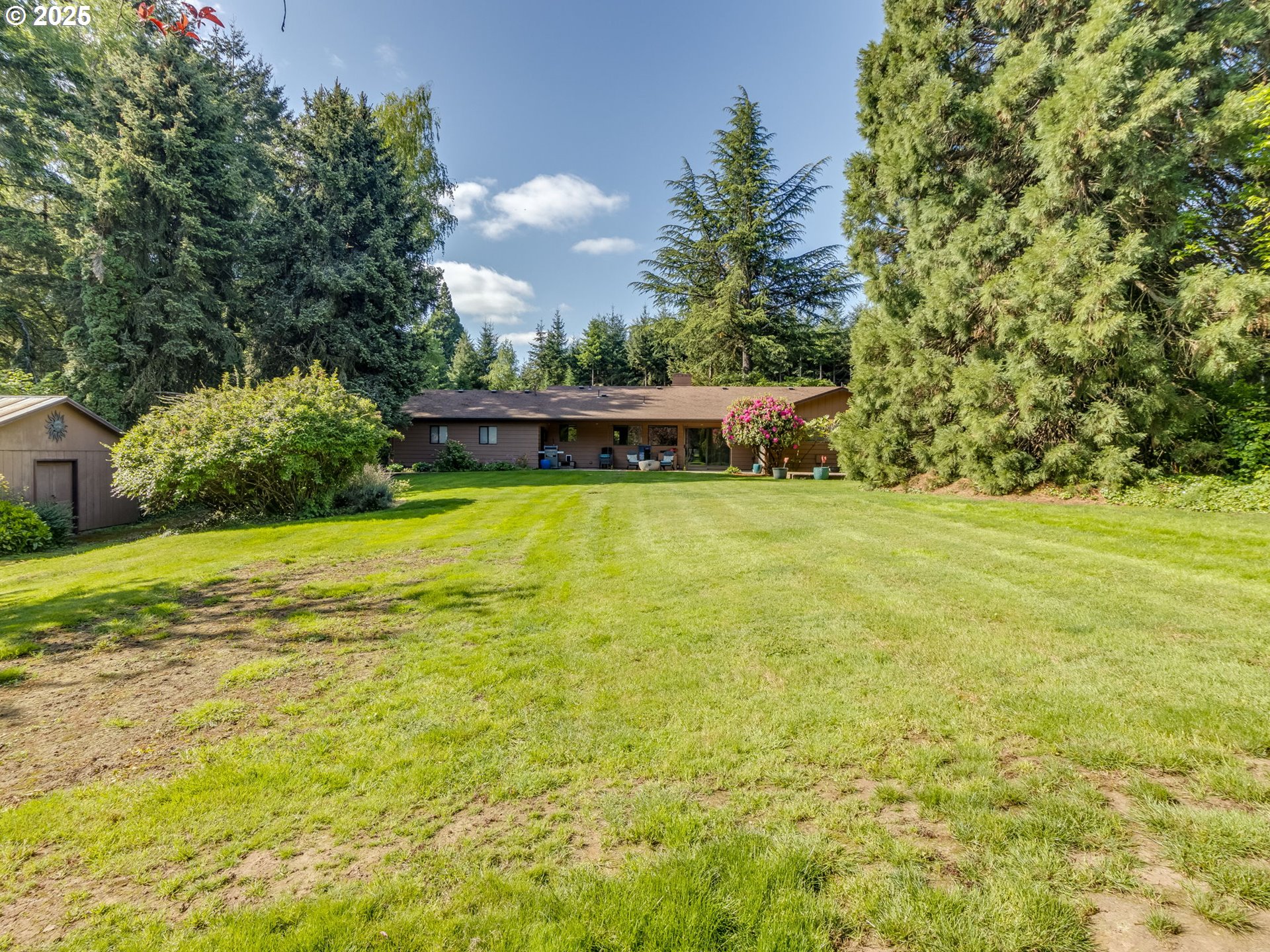 11963 Broadacres Road Northeast Hubbard, OR 97032 - Photo 9 of 42 a view of a swimming pool with an outdoor space and seating area