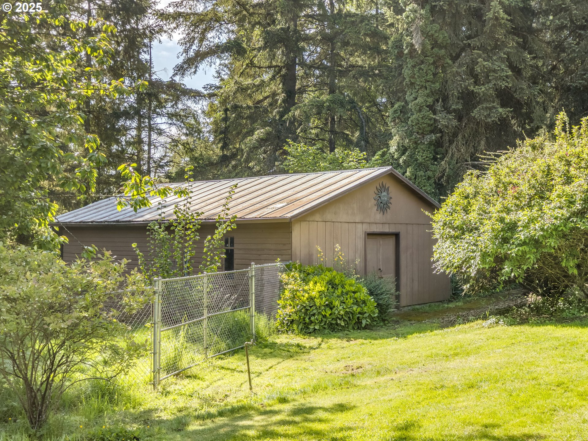 11963 Broadacres Road Northeast Hubbard, OR 97032 - Photo 10 of 42 a view of a house with pool and garden