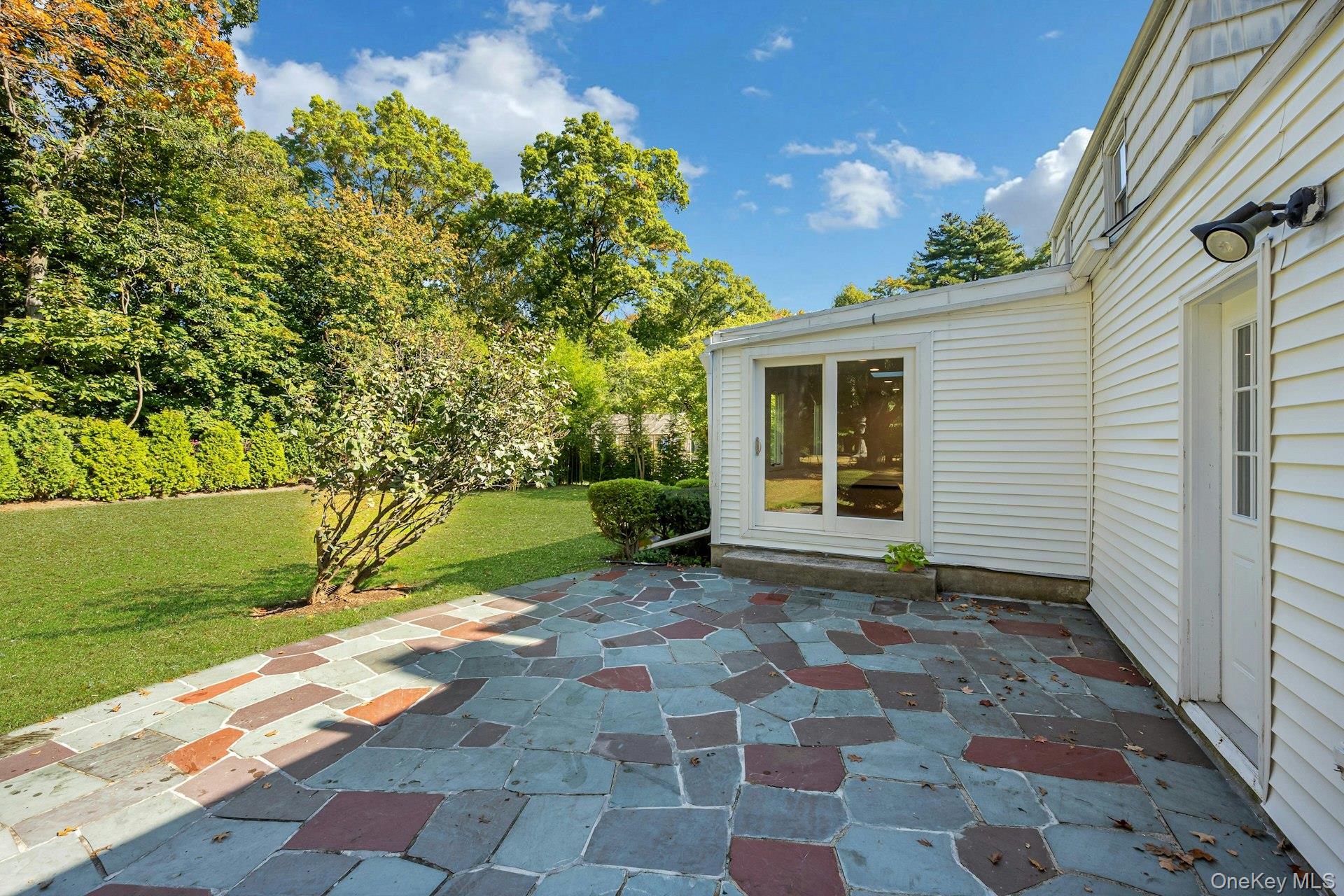 13 Colonial Road Scarsdale, NY 10583 - Photo 27 of 33 Sizeable backyard patio for barbecuing and entertaining