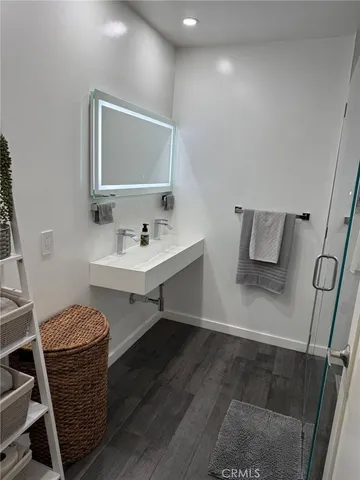 a bathroom with a sink and a mirror