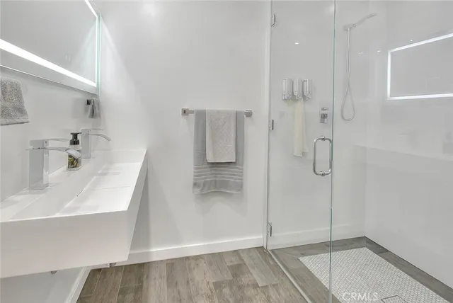 a bathroom with a bathtub and a shower