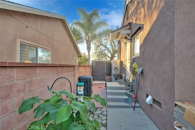 a vase of flowers sitting on a floor