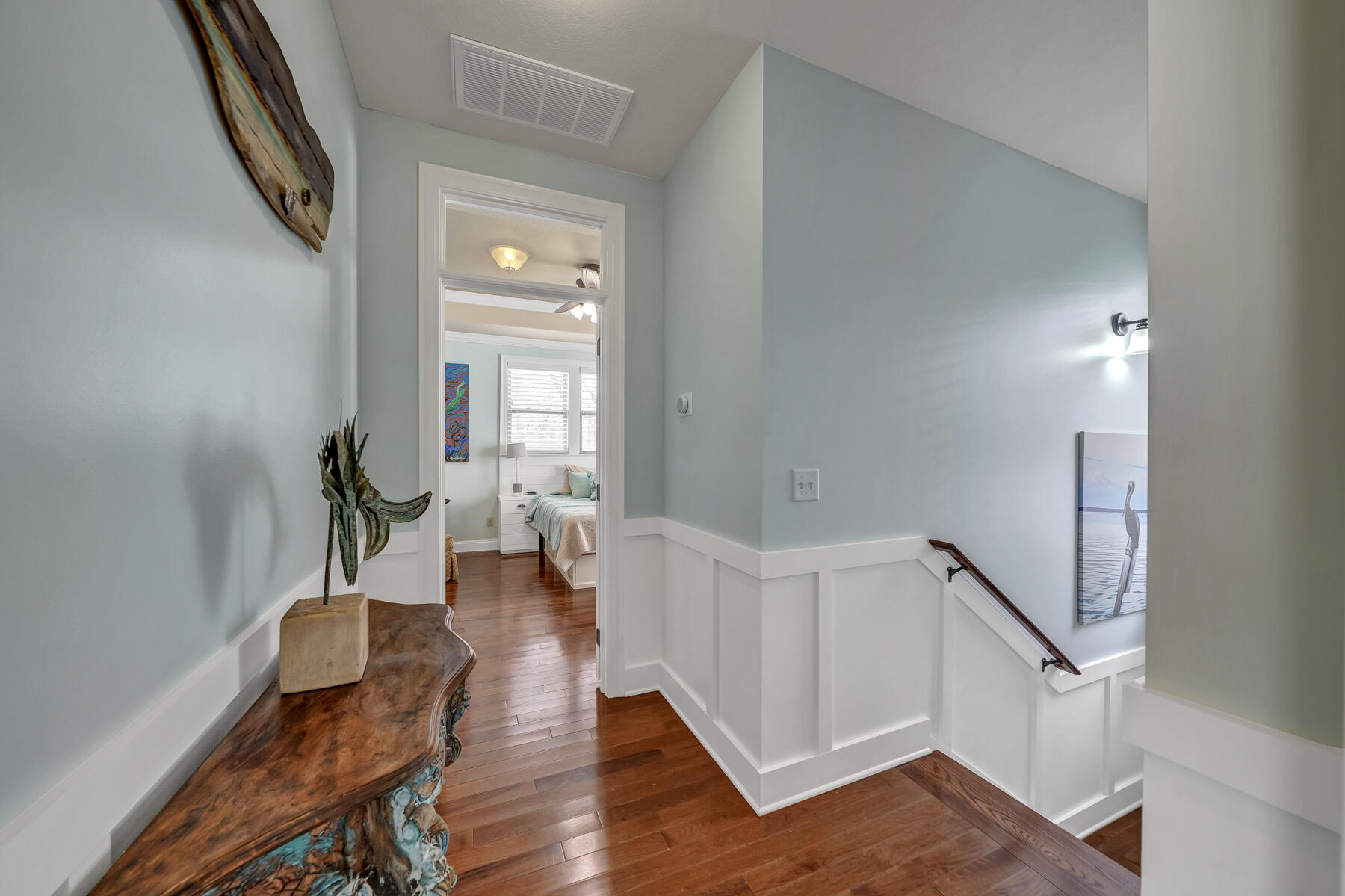 79 Beacon Point Drive Santa Rosa Beach, FL 32459 - Photo 23 of 37 a hallway with wooden floor furniture and a wooden floor