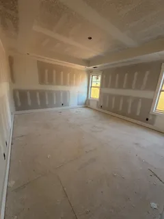 a view of empty room with windows