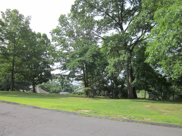 a view of a golf course with a trees