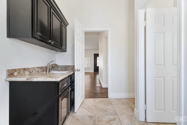 a kitchen with a sink and a microwave