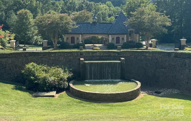 a view of a water fountain in a yard