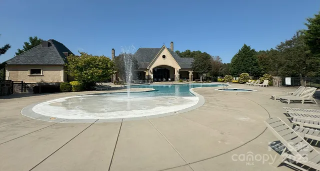 a view of a backyard with large trees