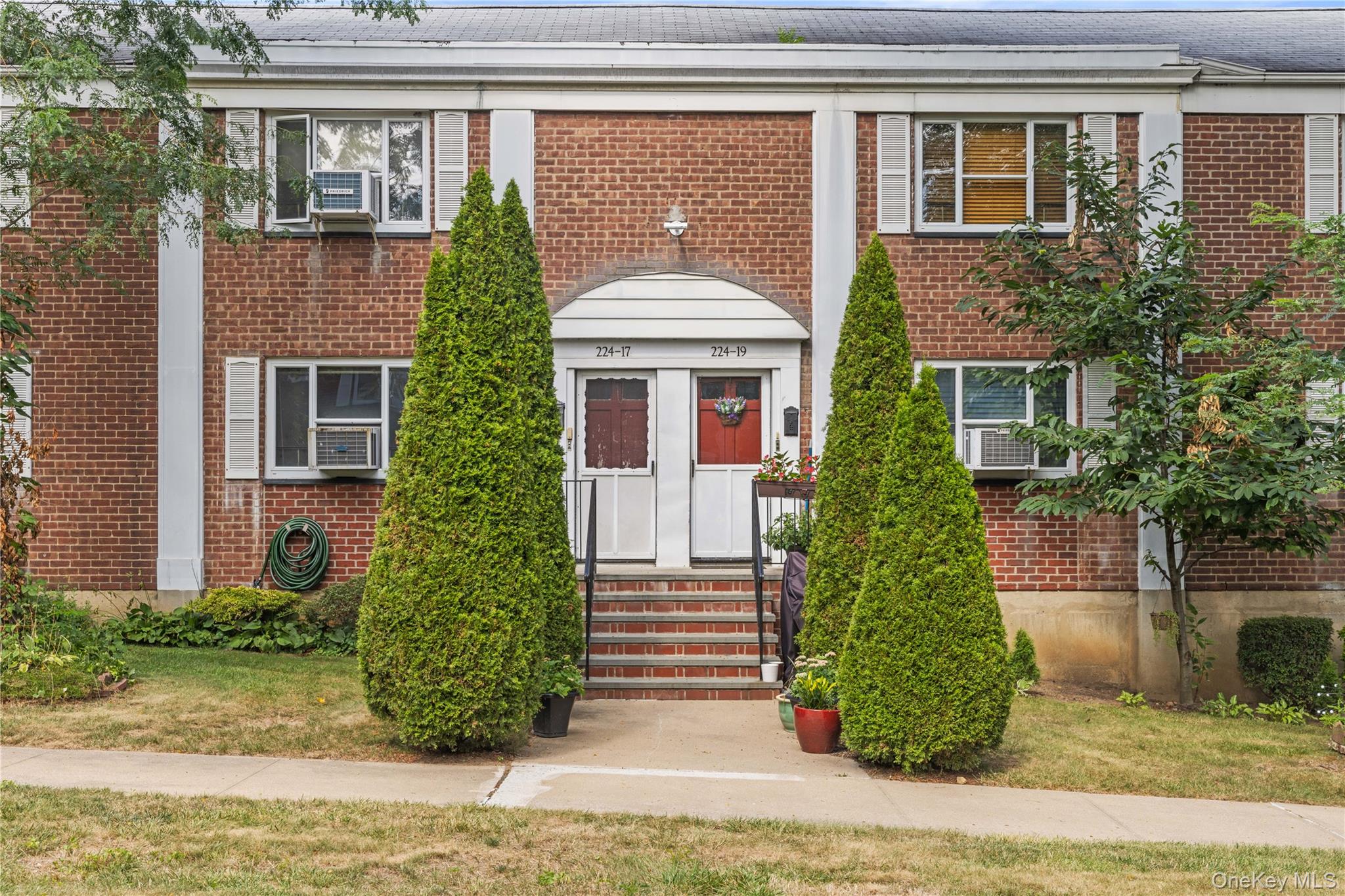View of front of home featuring brick siding