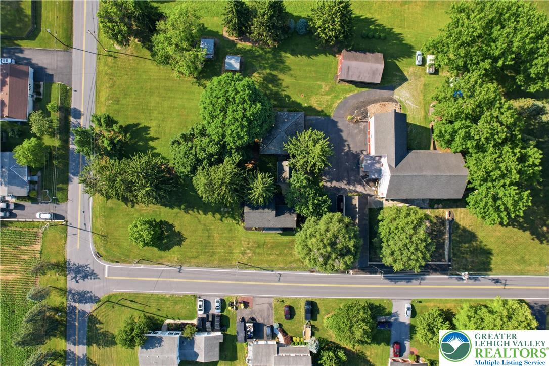 4682 Steuben Road Bethlehem, PA 18020 - Photo 45 of 79 An aerial view showcases a verdant lot with multiple structures and ample space.