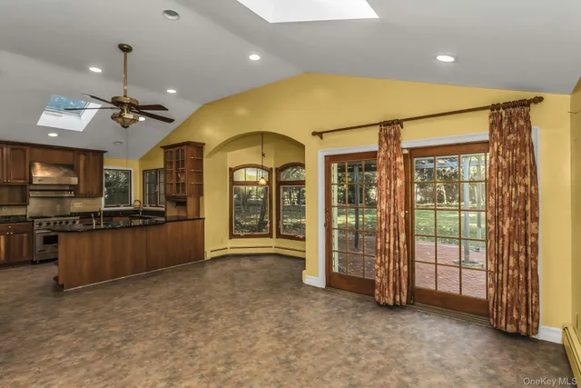 a view of a kitchen with a refrigerator a sink and dishwasher