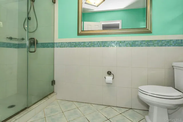 a bathroom with a sink toilet and a window