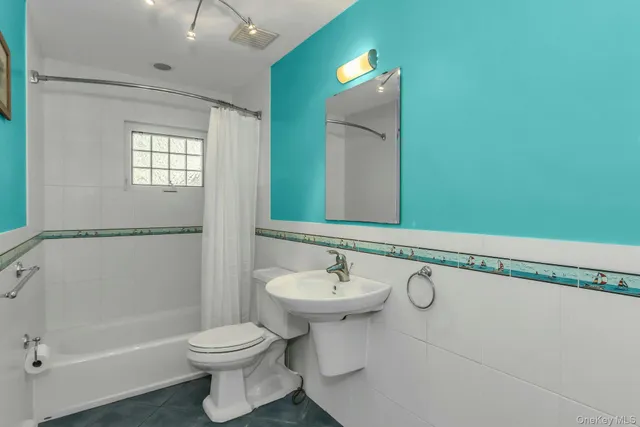 a bathroom with a shower and a door