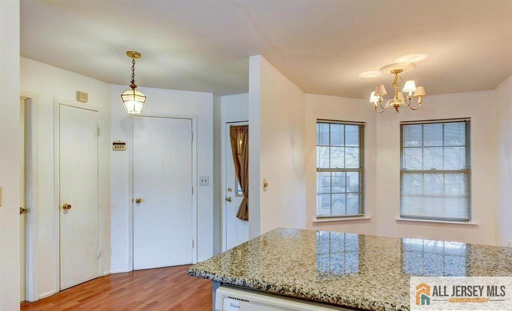 115 Salem Road North Brunswick, NJ 08902 - Photo 12 of 24 a bedroom with chandelier and window