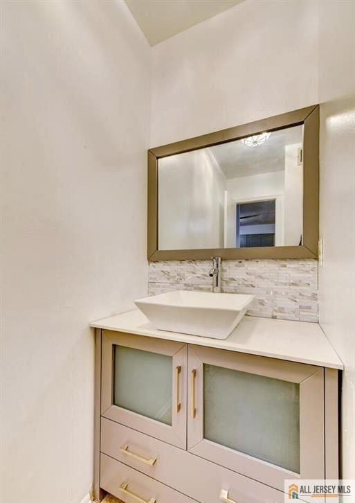 115 Salem Road North Brunswick, NJ 08902 - Photo 17 of 24 a bathroom with a sink and a mirror