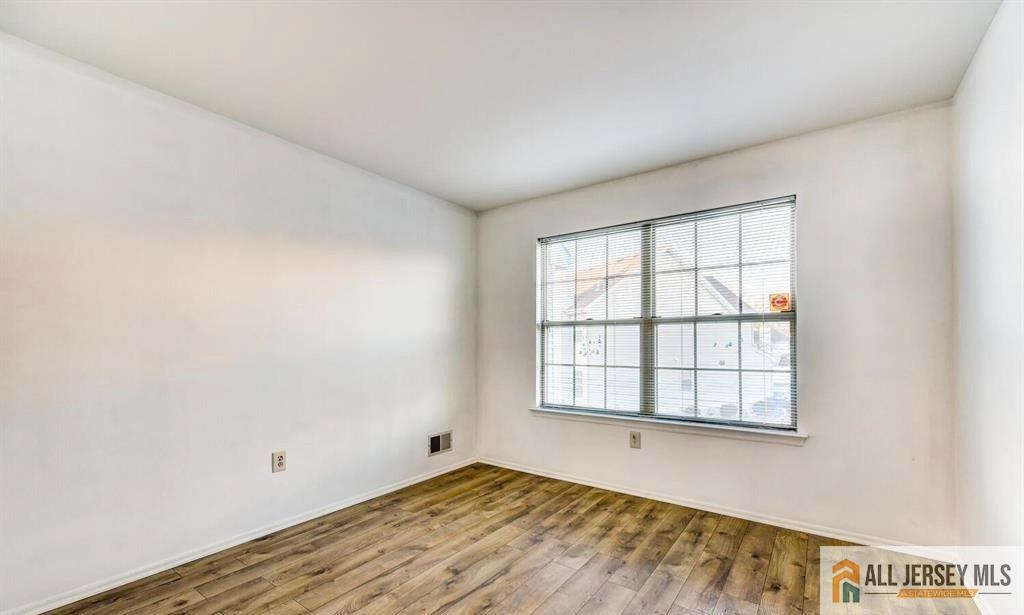 115 Salem Road North Brunswick, NJ 08902 - Photo 20 of 24 an empty room with wooden floor