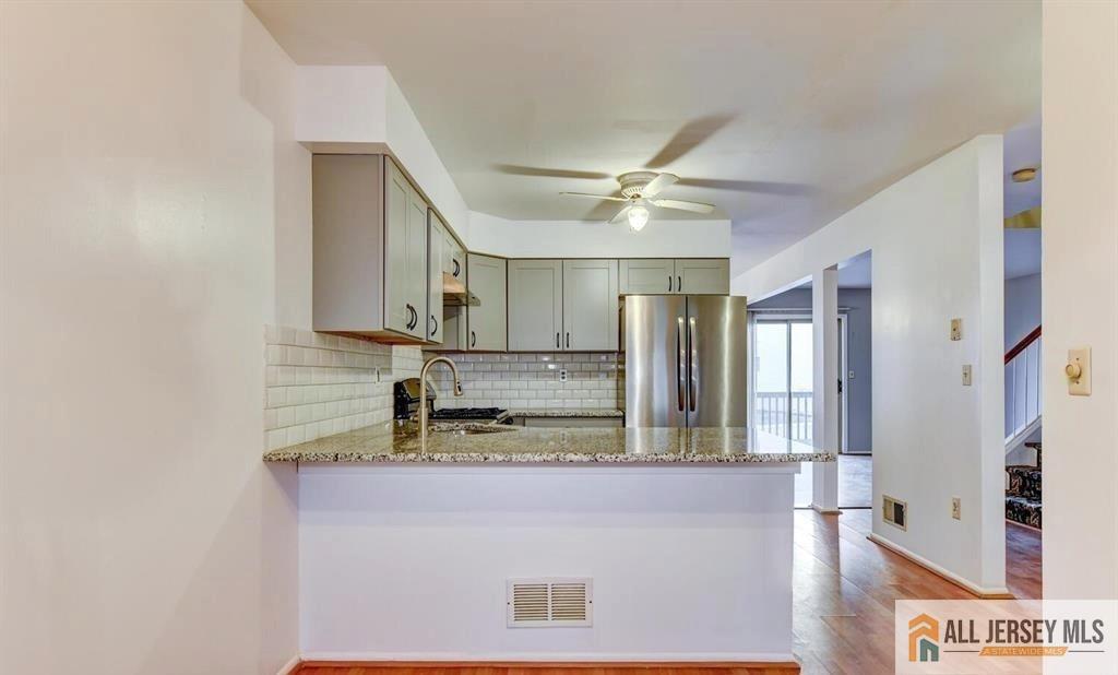 115 Salem Road North Brunswick, NJ 08902 - Photo 7 of 24 a bathroom with a sink a mirror and shower
