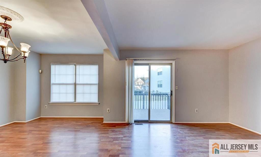 115 Salem Road North Brunswick, NJ 08902 - Photo 8 of 24 an empty room with wooden floor and windows
