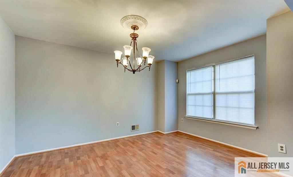115 Salem Road North Brunswick, NJ 08902 - Photo 9 of 24 a view of a bedroom with windows