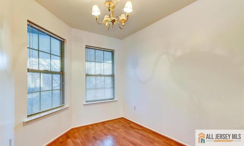 115 Salem Road North Brunswick, NJ 08902 - Photo 10 of 24 wooden floor in an empty room with a window