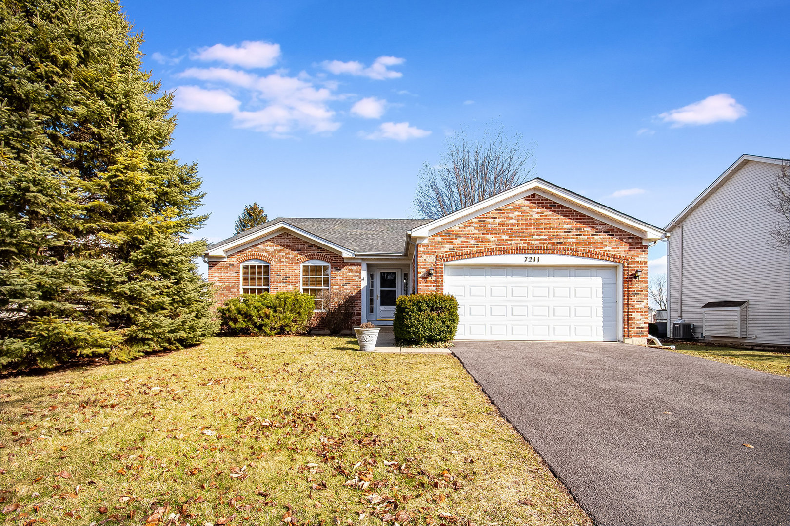 7211 Faxton Lane Plainfield, IL 60586 - Photo 1 of 21 a front view of a house with a yard and garage
